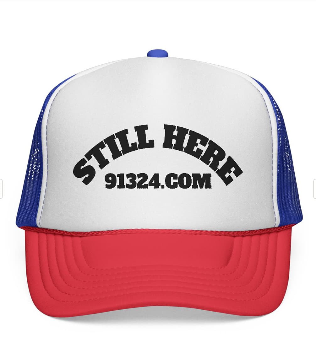 Still Here 91324 trucker hat in red, white, and blue